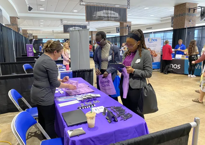 Student talking to employer at career fair