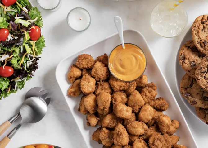 CFA Catering Nuggets on a white tray with dipping sauce