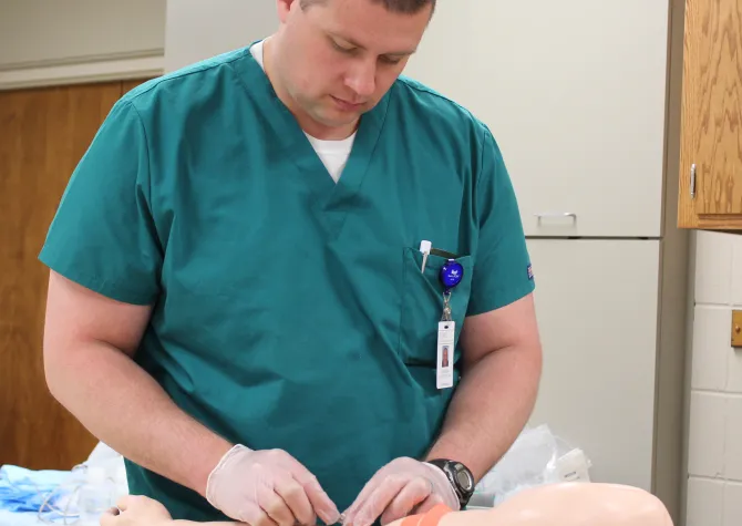Image of student practicing blood draw