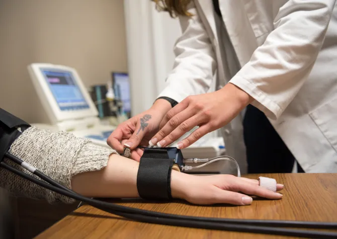 Student working in a clinical setting.