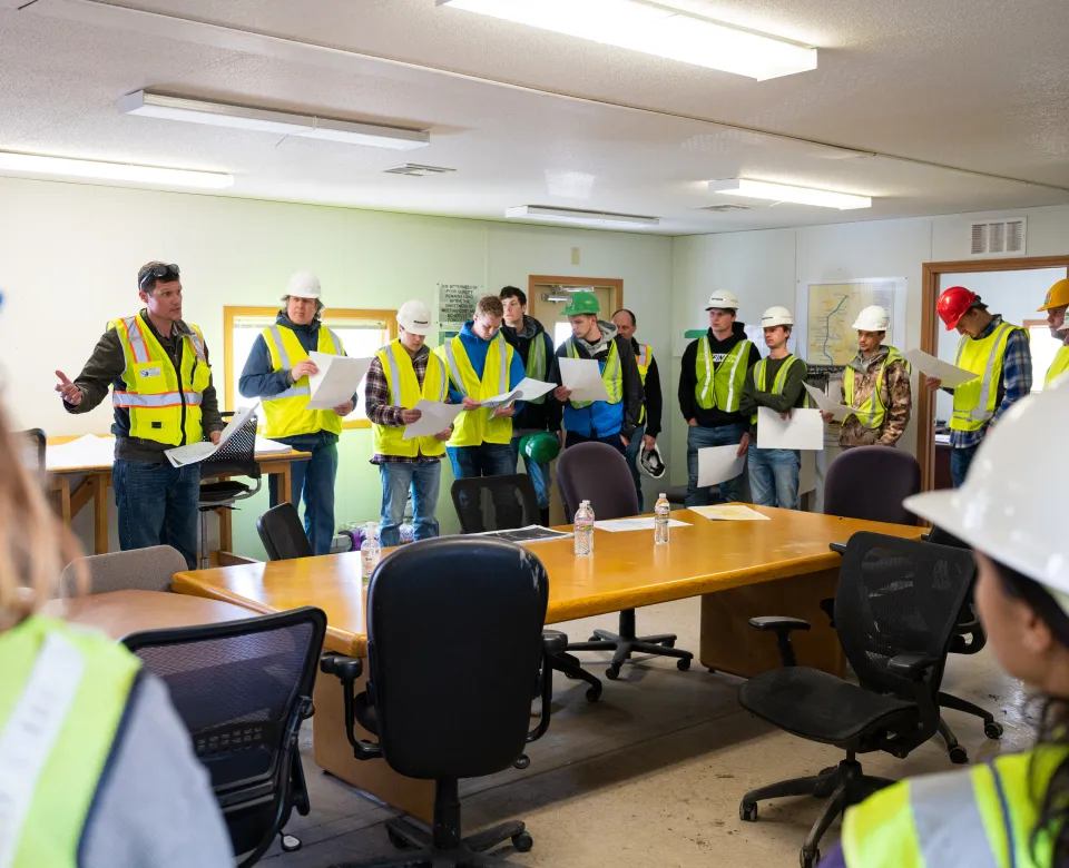 students meet with workers on the FM Diversion
