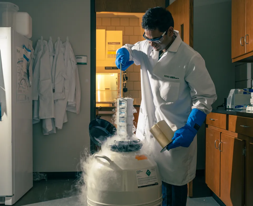 Student performing an experiment in lab