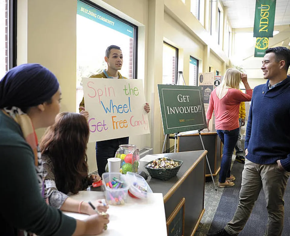 Students presenting at activities fair.