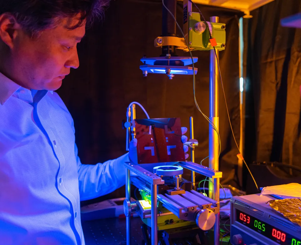 Research scientist working with lab equipment. 