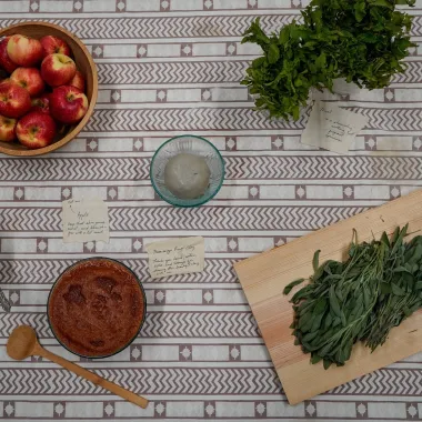 A table full of fruits and foods with notes beside them