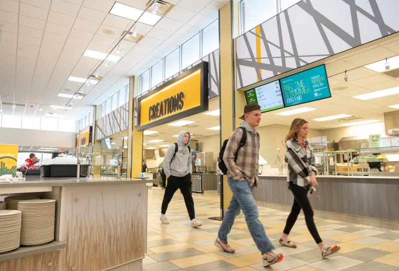 Residence Dining Center three people walking