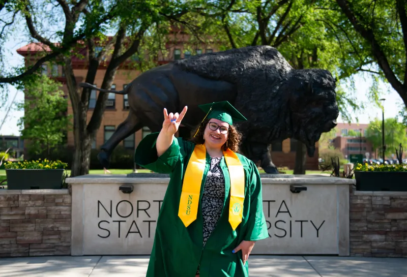 Kelsie Graduation Horns Up