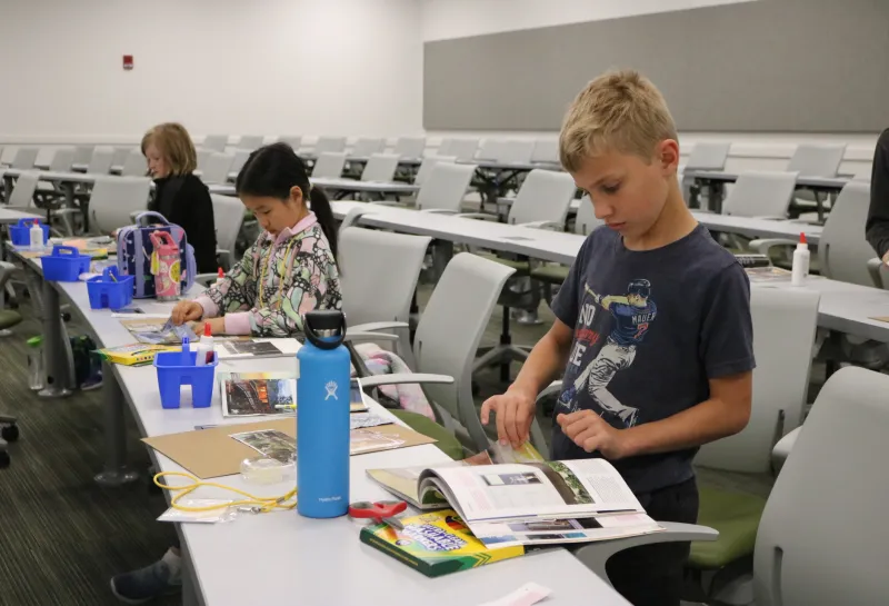 Kids designing a house at Herd U