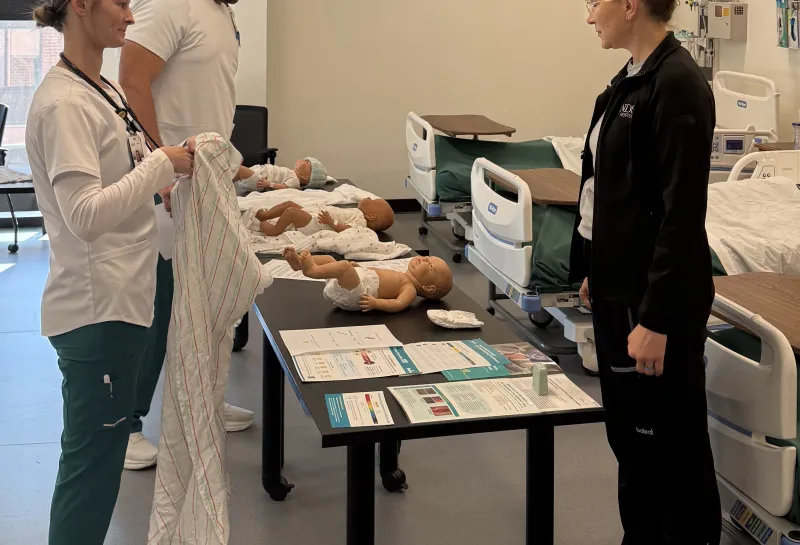 Nursing students talking with faculty