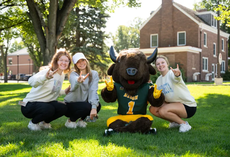 student posing with Thundar during the 2025 Homecoming kickoff