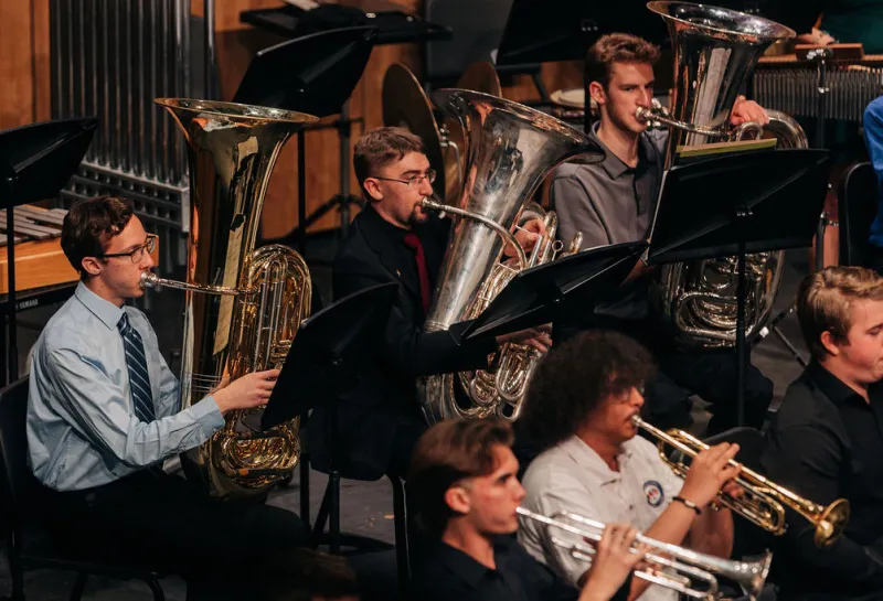 A group of tuba players performing as part of 线上赌博app's University Band.