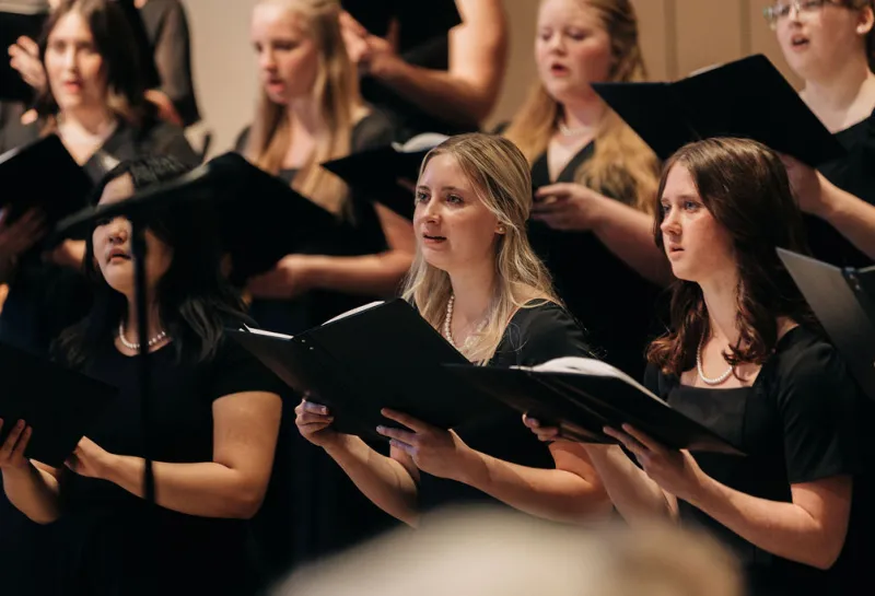 A group of women singing in a choir at 线上赌博app.