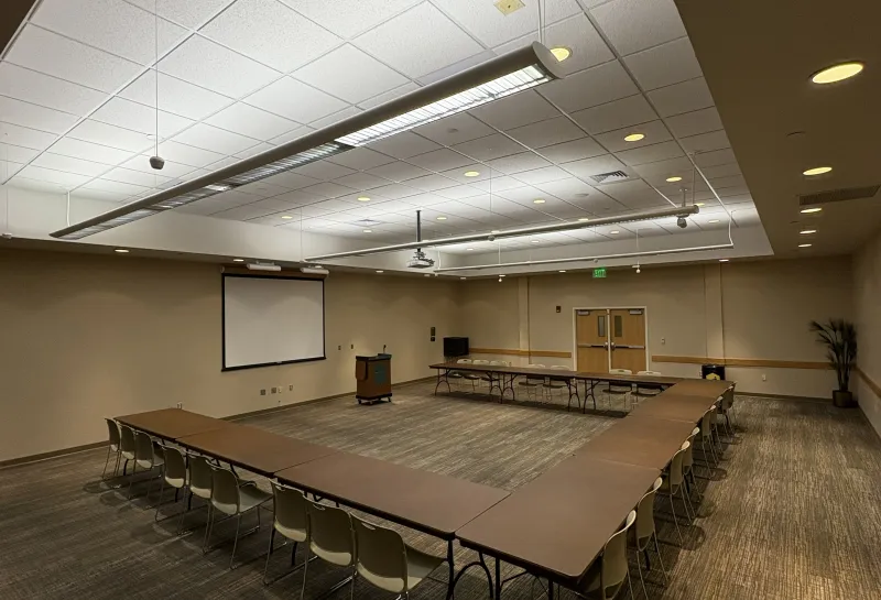 Sahnish room setup with U-shaped tables