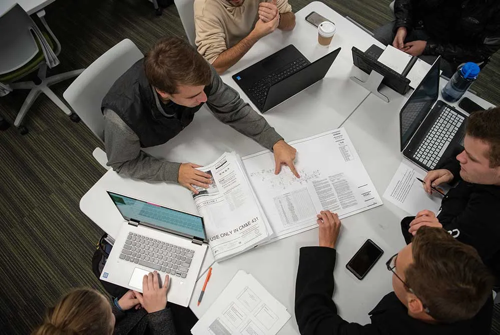 students work together on construction project
