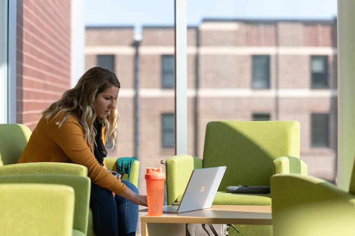 Student working on laptop in A.G. Hill study space.