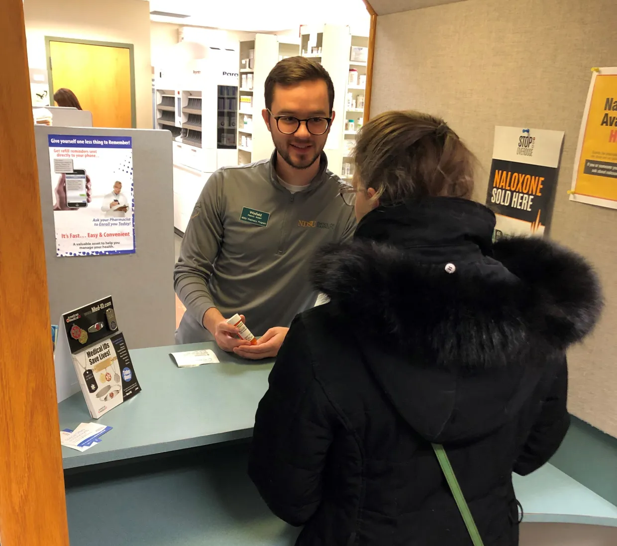 Student counseling a patient