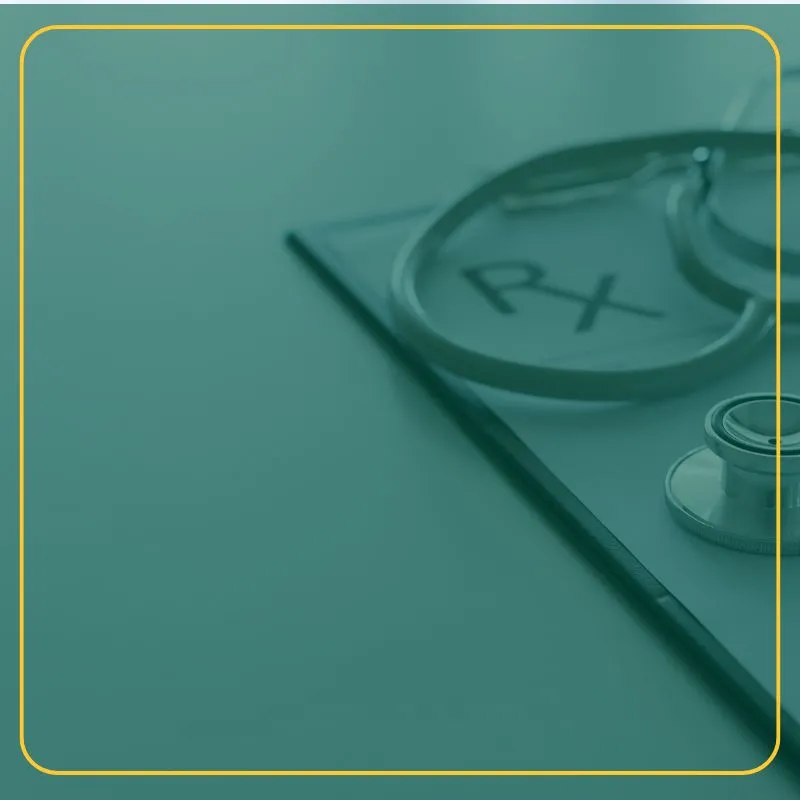 Stethoscope and prescription laying on a table