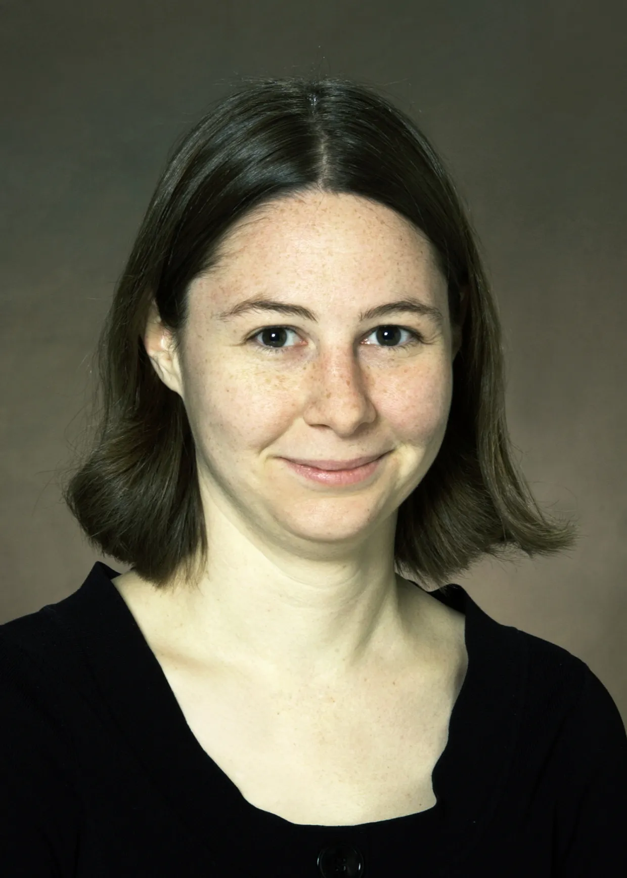 Erin Conwell smiling confidently at camera. 