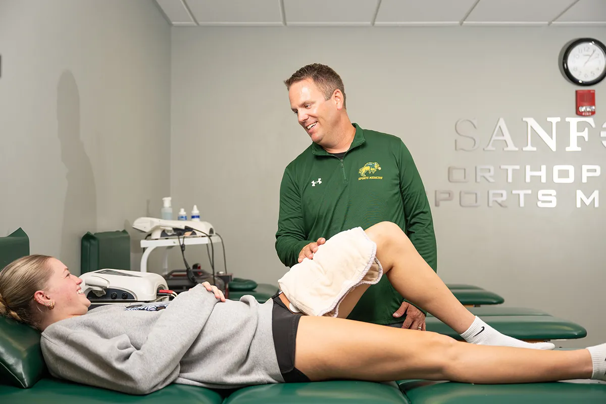 alumni Mike Kjellerson working with a student athlete