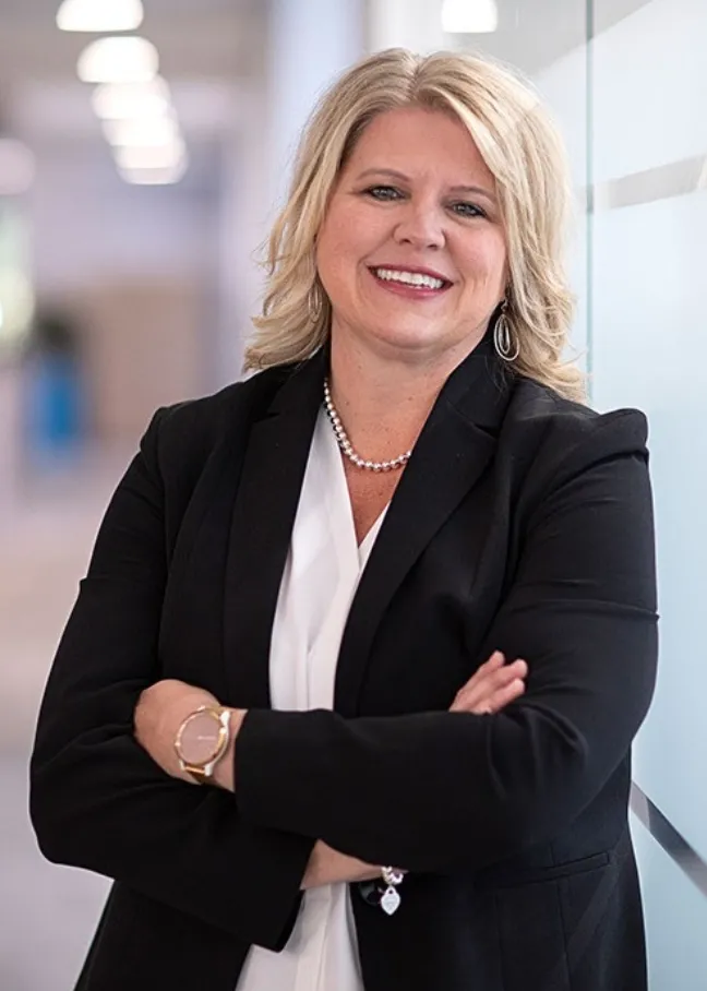 Shelli McGuire looking confidently at camera.