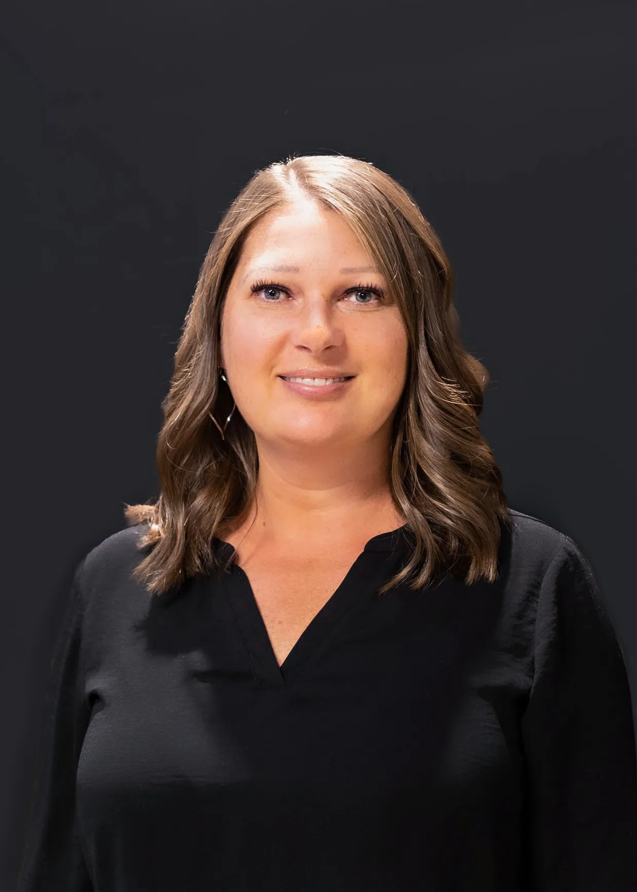 Alison smiling confidently at camera.