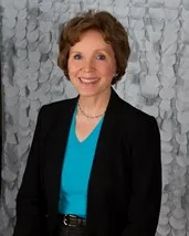 Patty Corwin smiling confidently at camera.