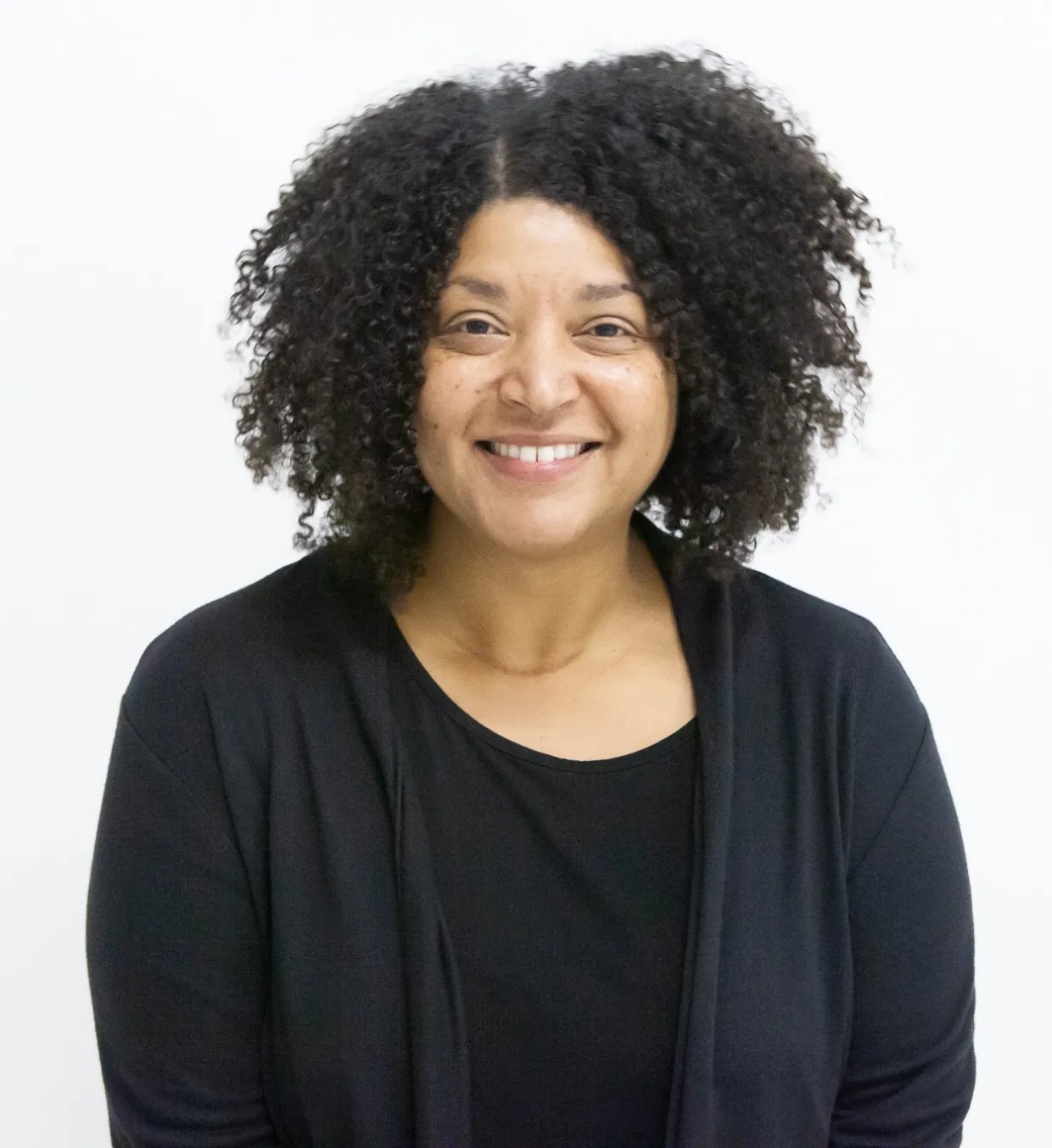 Veronica Michael smiling confidently at camera.