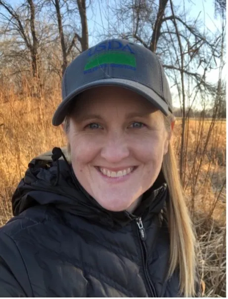 Page Klug smiling confidently at camera.