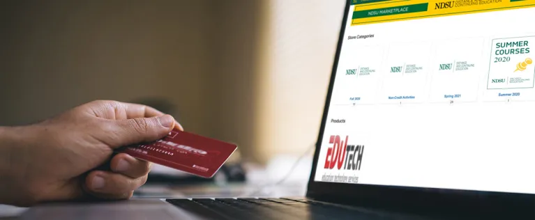 Person with credit out ready to pay for a course