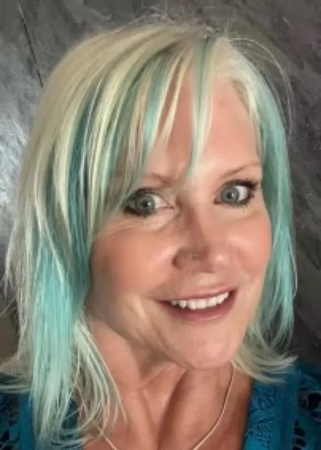 卡洛琳Hackerott smiling confidently at the camera